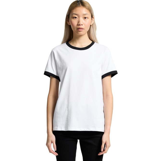 A white t-shirt with black ringer accents and a logo on the chest. The model stands against a plain background.