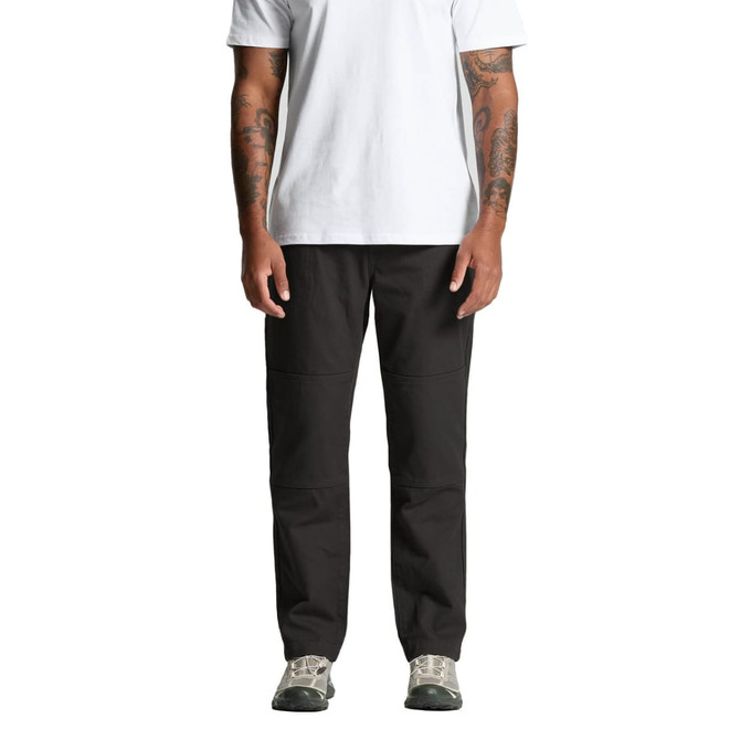 A person wearing black cargo pants, standing straight, with arms at their sides, in a plain white t-shirt and shoes.