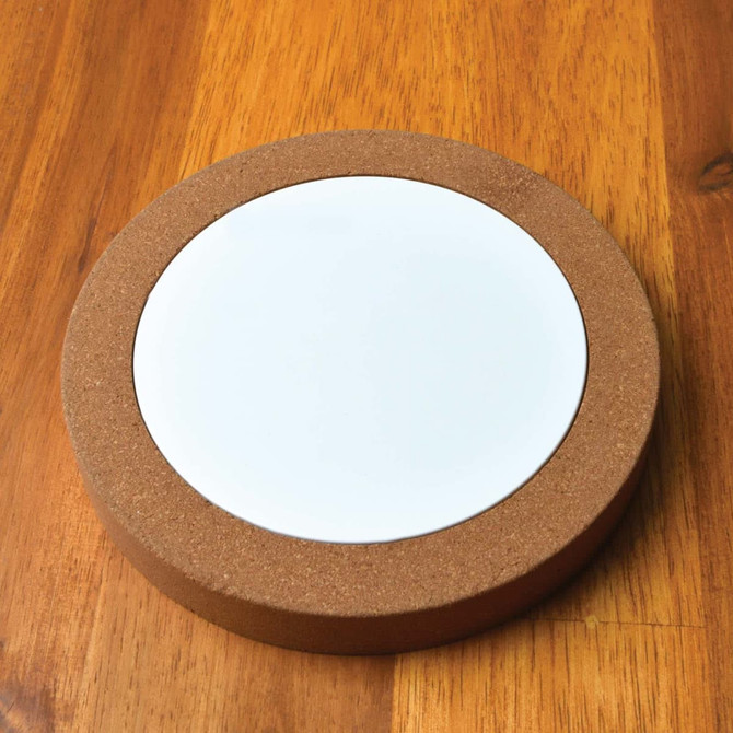 A cork wireless charger featuring a sleek, round design with a white charging pad in the center.