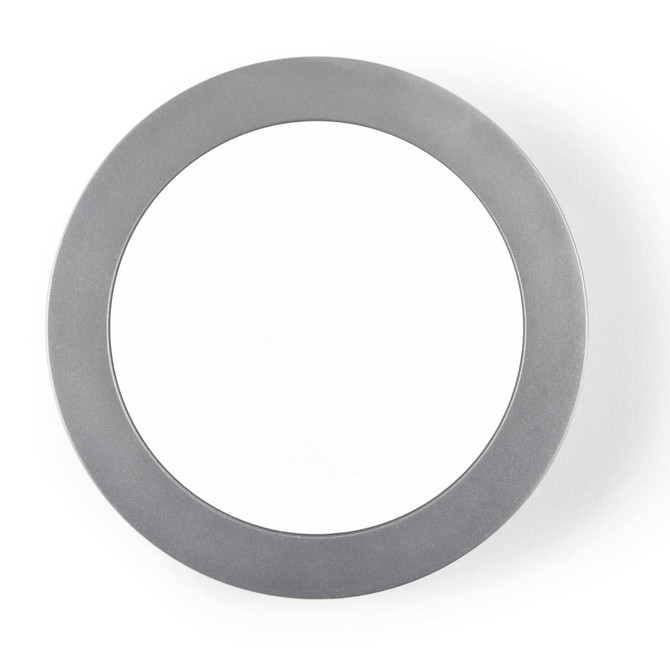 A sleek, circular aluminium wireless charger with a smooth surface, designed for fast charging of compatible devices.