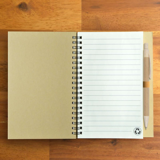A recycled kraft notebook with lined pages, paired with a beige eco-friendly pen, featuring a logo.