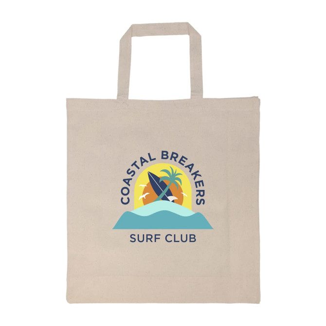 A beige tote bag with a logo featuring surfboards, palm trees, and waves in blue and yellow tones.