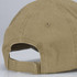 A faded cap in a tan color with a rear adjustable strap.