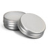 Two silver lip balm tins, one open to reveal the white balm inside. Both tins have a metallic finish.