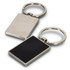 A rectangular key ring featuring a polished silver finish and a black textured surface on one side.