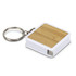A bamboo tape measure key ring with a white casing and a metal key ring attachment.