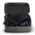 A medium, wheeled suitcase in green with a patterned interior, featuring an open, empty compartment and a logo.