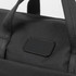 A black computer bag with sturdy handles and a branding logo on the front.