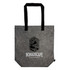 A grey tote bag with black handles and a logo, featuring a minimalist design.