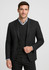 A tailored black blazer over a black sweater, paired with a checkered shirt underneath. The model is smiling.