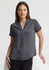 A short-sleeve, button-up shirt in grey, featuring a collared neckline, displayed on a model against a neutral background.