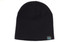 A black roll down beanie made from recycled materials, featuring a small logo tag.