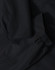 A waterproof jacket in black featuring elasticated cuffs and a durable fabric. The jacket has a logo present.