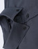 A close-up of a grey cotton blend long-sleeve shirt featuring button details and a collar.