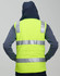 A unisex hi-vis hooded puffer vest in bright yellow with reflective strips and a blue hood.