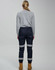 Cotton stretch drill cuffed work pants in navy, featuring reflective tape and a fitted design, viewed from the back.