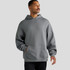 A grey hoodie with a kangaroo pocket and a hood, worn by a man standing against a plain background.