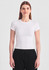 A white women's baby tee with short sleeves, paired with black pants, displayed against a plain background.