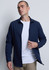 A navy long sleeve shirt is displayed, featuring a button-up front and a fitted design. The model wears a white T-shirt underneath.