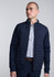 A navy blue men's jacket with a quilted front silhouette, paired with a collared shirt underneath.