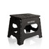A black utility stool with a textured top and cut-out sides, featuring a logo on one side.