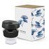 A drink bottle with a black lid and transparent body, accompanied by a decorative box featuring floral designs.