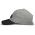 A grey cap with a black peak and a patch on the side, featuring a simple design.