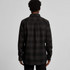 A black check button-up shirt with a solid back and long sleeves. The shirt features a classic collar and a logo.
