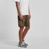Brown walk shorts with an elastic waistband, featured alongside a plain white shirt and grey footwear.
