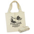 A cream foldaway tote bag with a logo design and matching fabric tie. It features illustrations of vegetables.