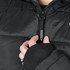 A black puffer jacket featuring a zip closure and ribbed cuffs, worn by a person adjusting the zipper with one hand.
