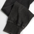 A faded black unisex hoodie showing the detail of the cuffs and sleeves, featuring a subtle texture and a logo.