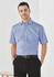 A short-sleeve men's button-up shirt in light blue, featuring a collar and a subtle texture. It has a logo on the chest.
