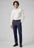 Men's classic pleat pants in navy blue, paired with a white shirt and featuring a logo. Suitable for formal wear.