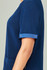 A navy blue unisex scrub top featuring short sleeves and a pocket, with a small metallic detail on the sleeve.