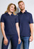 A women's short sleeve polo shirt in navy, featuring a classic collar and a logo. Styled alongside a men's polo shirt.