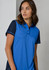 A women's short sleeve polo shirt in blue, featuring a darker blue trim and a logo on the chest.