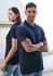 A navy short sleeve polo shirt featuring a classic collar and a logo, displayed by male and female models.