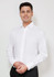 A white long sleeve button-up shirt with a single chest pocket, featuring a logo on the pocket area.