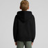 A black youth hoodie with a hood, viewed from the back, featuring a logo on the sleeve.