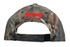 A camo 6-panel cap featuring a vibrant red logo on the back. The design includes shades of green and brown.