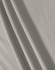 A textured, light grey fabric featuring soft folds. The material is suitable for polo shirts and has a subtle sheen.