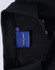 A black polo shirt featuring a collar and a label inside with branding.