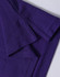 A close-up of a purple polo shirt, featuring a textured fabric and folded collar. The shirt has a logo.