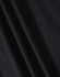 A close-up of black fabric showcasing the texture of a polo shirt. The material appears smooth and lightweight.