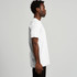 A white t-shirt is displayed on a model, featuring a relaxed fit and a side view. The shirt has a logo.