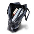 A black laptop bag with an open top, containing notebooks and documents inside. It features a shoulder strap and a logo.