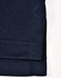 A close-up of a navy blue sustainable poly/cotton polo shirt sleeve with stitching details. It has a logo.