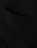 A close-up view of a black men's full-zip fleecy hoodie featuring a front pocket and a soft texture.