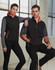 Men's softshell contrast vest in black with grey sleeves and orange accents, featuring a zipper and pockets.
